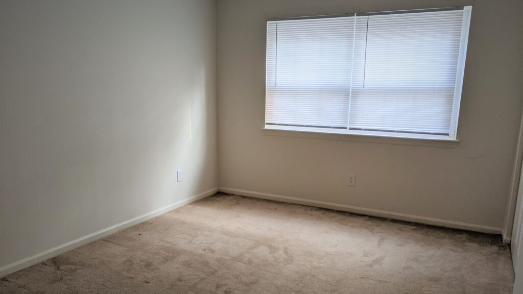 "Before" image for a dance floor on carpet project. Empty carpeted bedroom.