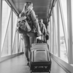 woman in airport with backpack | Dance Insight: Dancer Moving to a New City