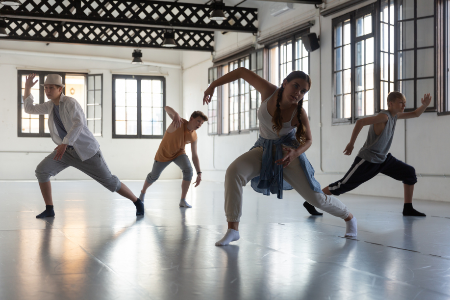 four dancers doing contemporary dance in a dance studio | Dance Insight | 10 Things Pro Dancers Should Do Before Moving to a New City